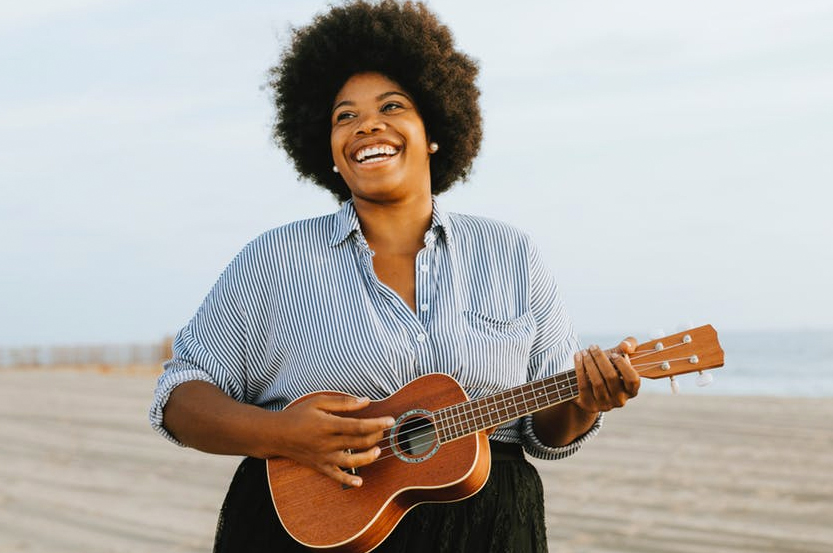 woman playing ukulele