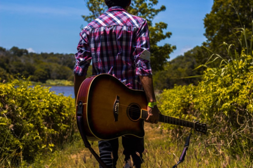 guy holding guitar